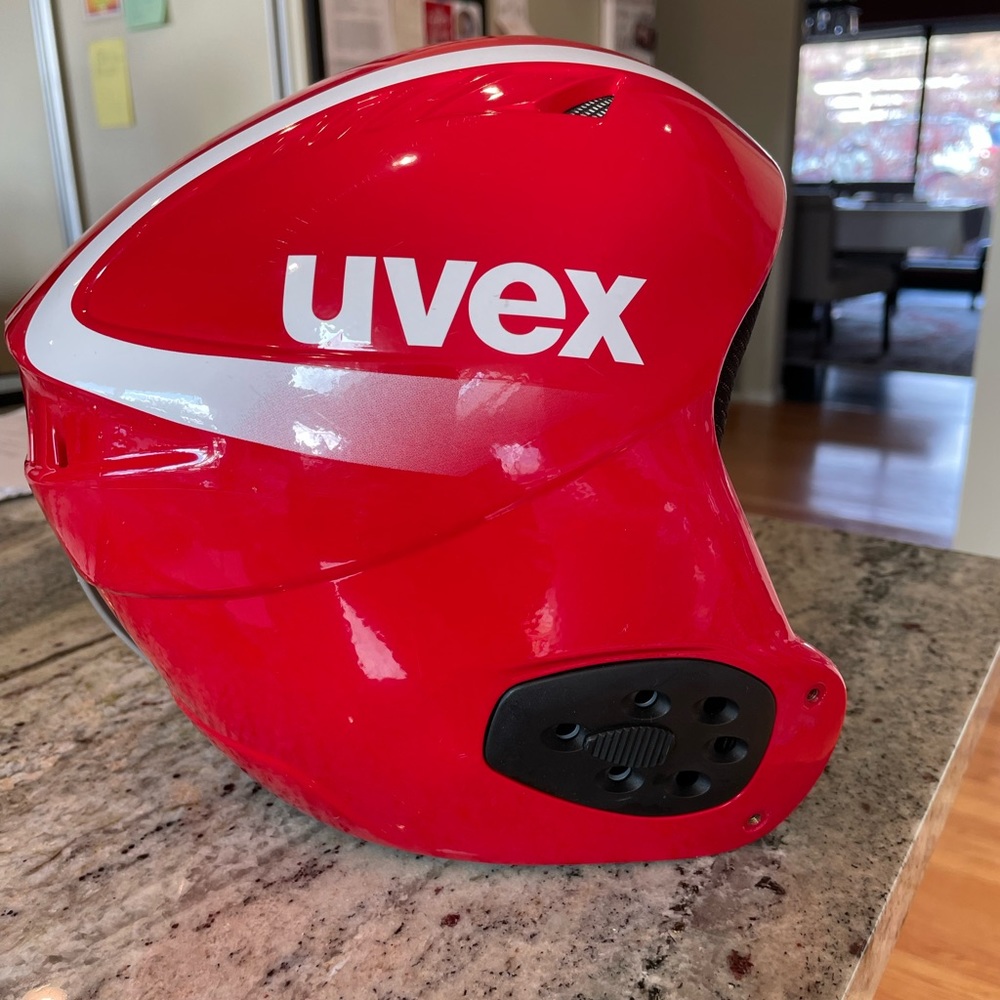 Red uvex ski racing/ hard ear ski helmet